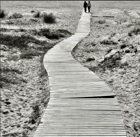 couple walking to the end by Jesus Leon